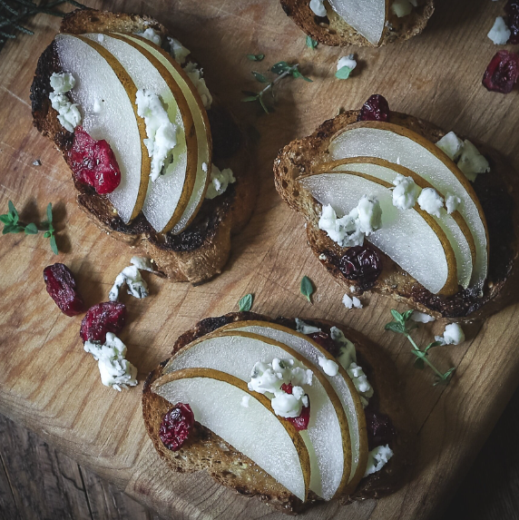 Pomegranate-Pear Crostini with Arlotta Fig Jam and Balsamic Drizzle